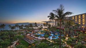 A resort with a large pool area, palm trees, and a view of the ocean at dusk. - Oceanfront - 3 Bedroom - Marriott's Maui Ocean Club: Lahaina, Napili Villas - Full Resort Access (Lahaina)