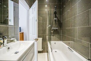 Combined shower/bathtub, hair dryer, towels, soap