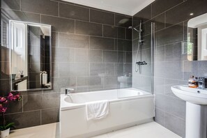 Combined shower/tub, hair dryer, towels, soap