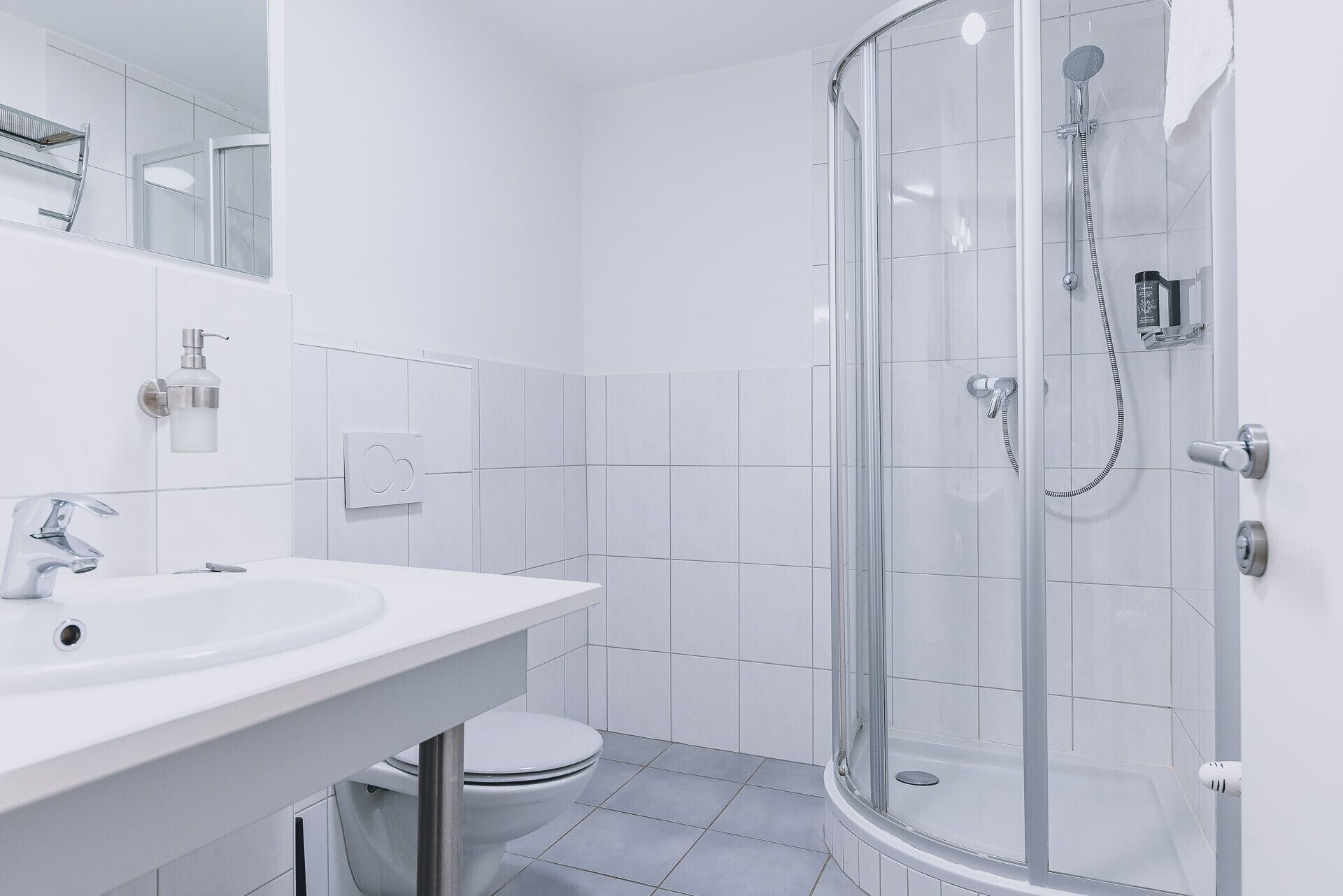 Bathtub, hair dryer, towels, soap
