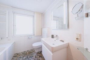 Bathtub, hair dryer, towels