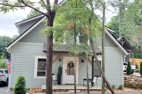 Summer view of 534 Fisher Road with comfy chairs. Friendly neighbors!