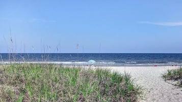 On the beach, sun loungers, beach towels