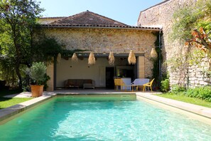 Outdoor pool, a heated pool, pool loungers