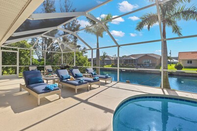 Villa Evelyn's Palms - Beautiful views on a Gulf-access canal! Heated pool w/spa - SWFL Rentals