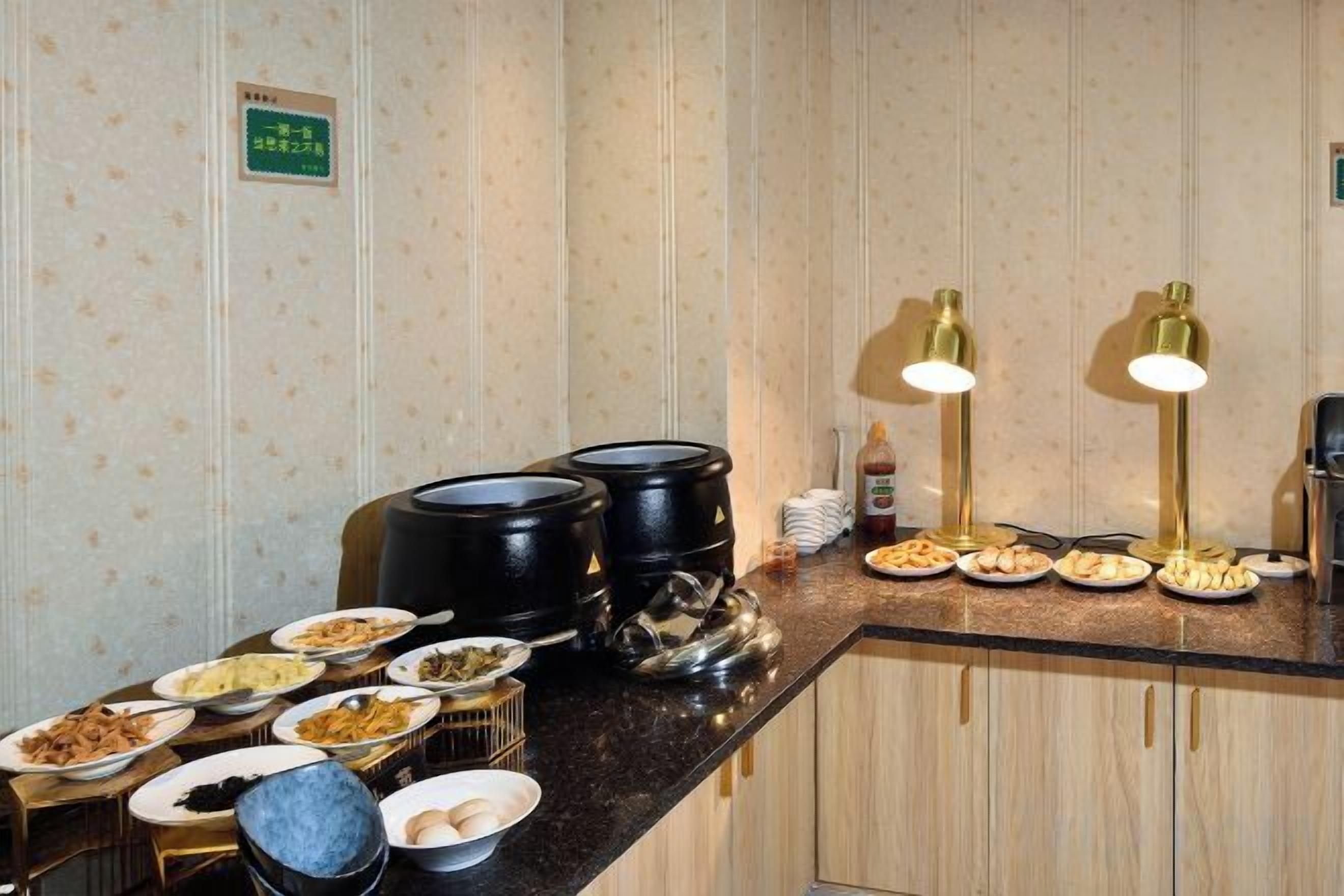 A buffet setup with various dishes and a coffee station.
