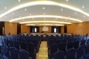 A conference room with a long table and chairs arranged for a meeting. - Sanjianghe International Hotel (Pingle)