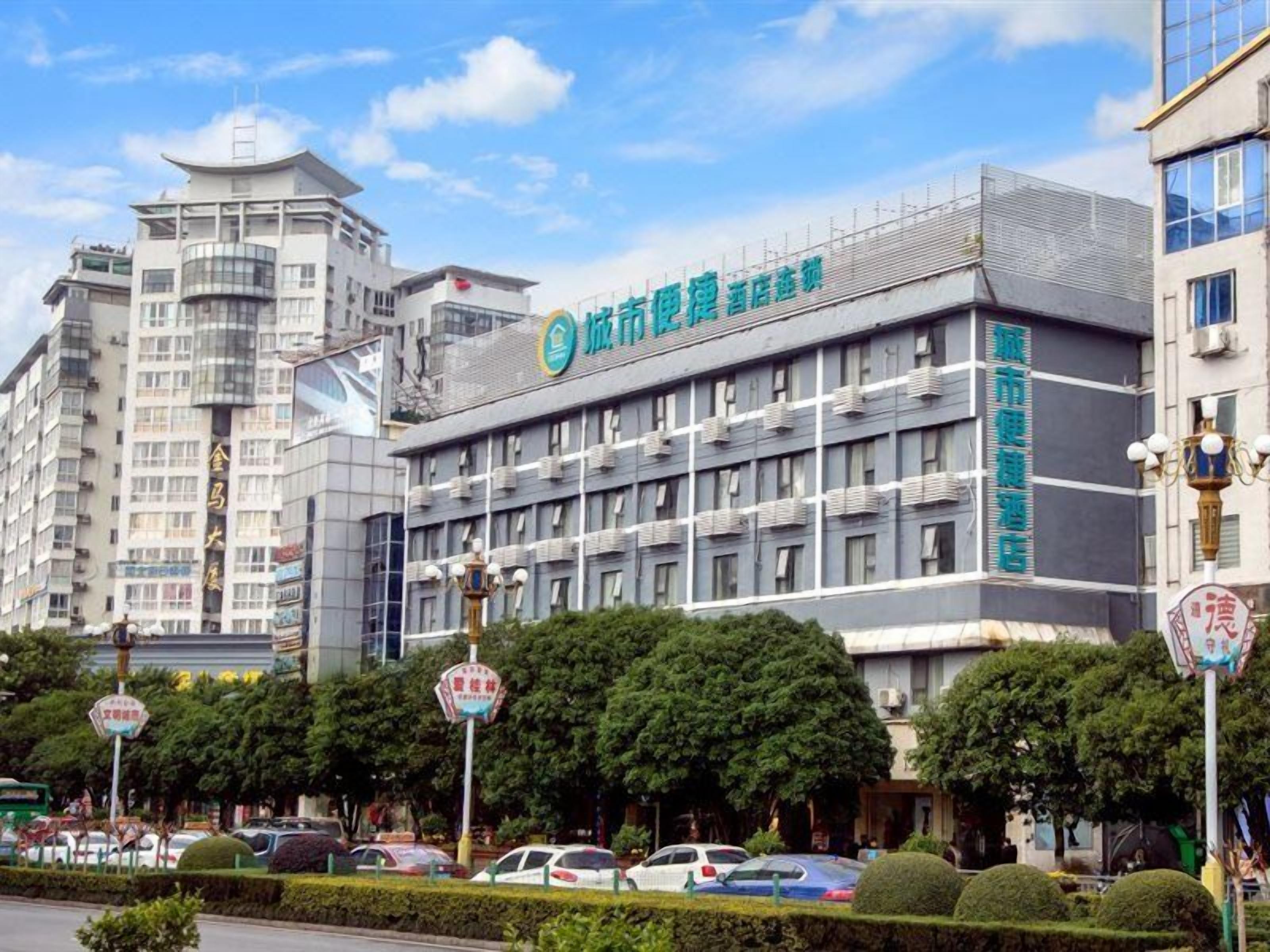 A multi-story building with signage indicating it is a hotel.