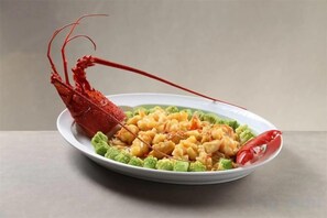 A plate with a lobster tail and pasta. - Tang Dynasty Hotel (Ningjin)