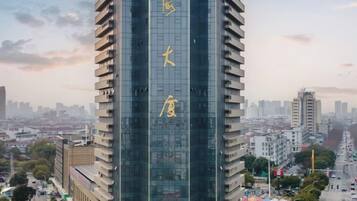 A tall building with large Chinese characters on its facade.