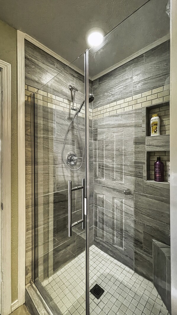 Combined shower/tub, hair dryer, towels, soap