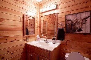 Bathtub, hair dryer, towels, soap