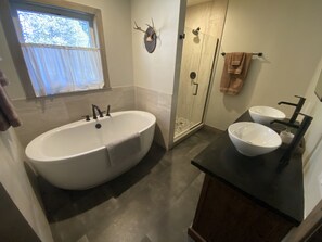 Bathtub, hair dryer, towels, soap
