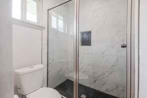 Bathtub, hair dryer, towels, soap