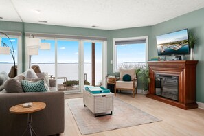 TV, fireplace, books