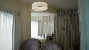 Family Room | Premium bedding, in-room safe, desk, soundproofing - DE GLANCE HOTEL (Surat)