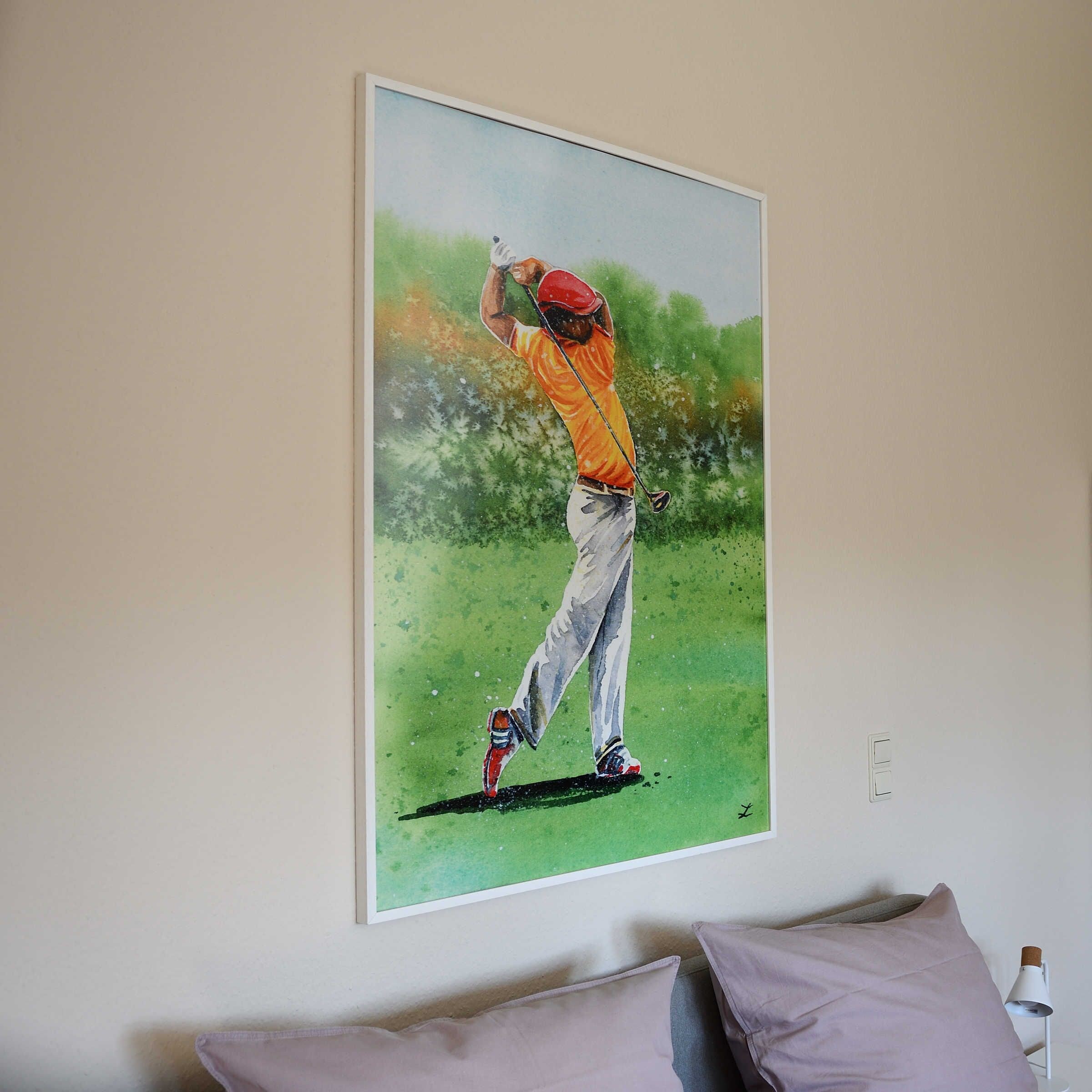 A painting of a golfer in mid-swing on a wall.