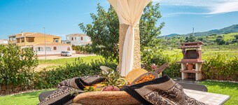 Vacation Home "Casa a Schiera Budoni" with Terrace & Garden