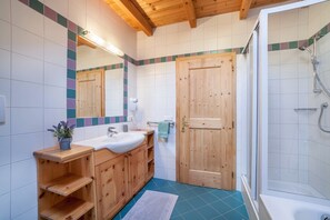 Bathtub, hair dryer, towels