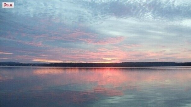A calm lake at sunset with a clear sky and distant shoreline. - Cottage 7 - Year Round - Pet Friendly $50 Fee - Stand Alone 1 Bedroom / 1 Bath (Wolfeboro)