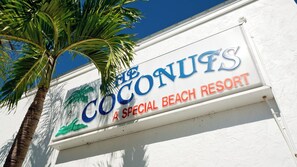 A sign for The Coconuts, a Special Beach Resort.