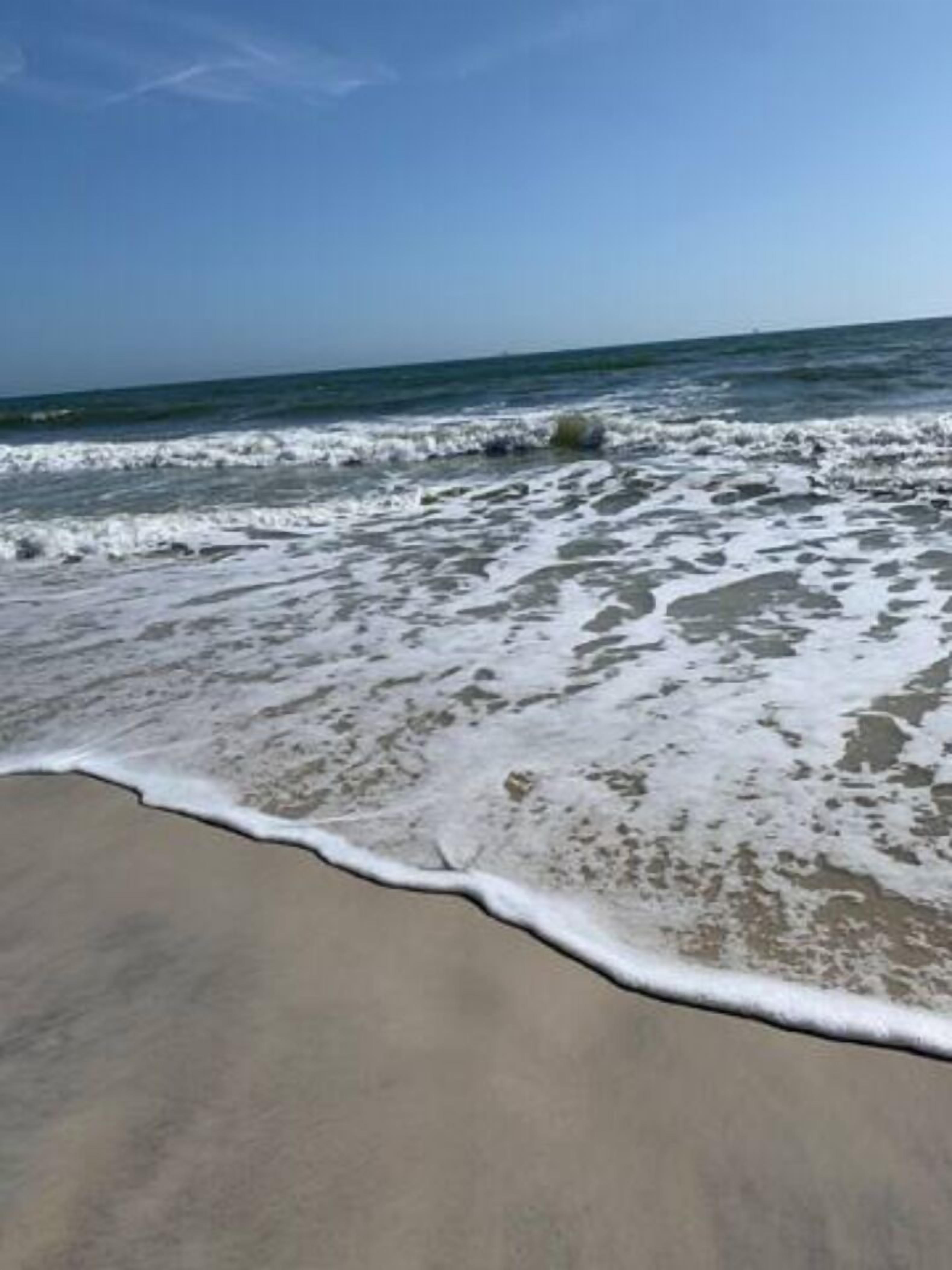On the beach, sun loungers, beach towels