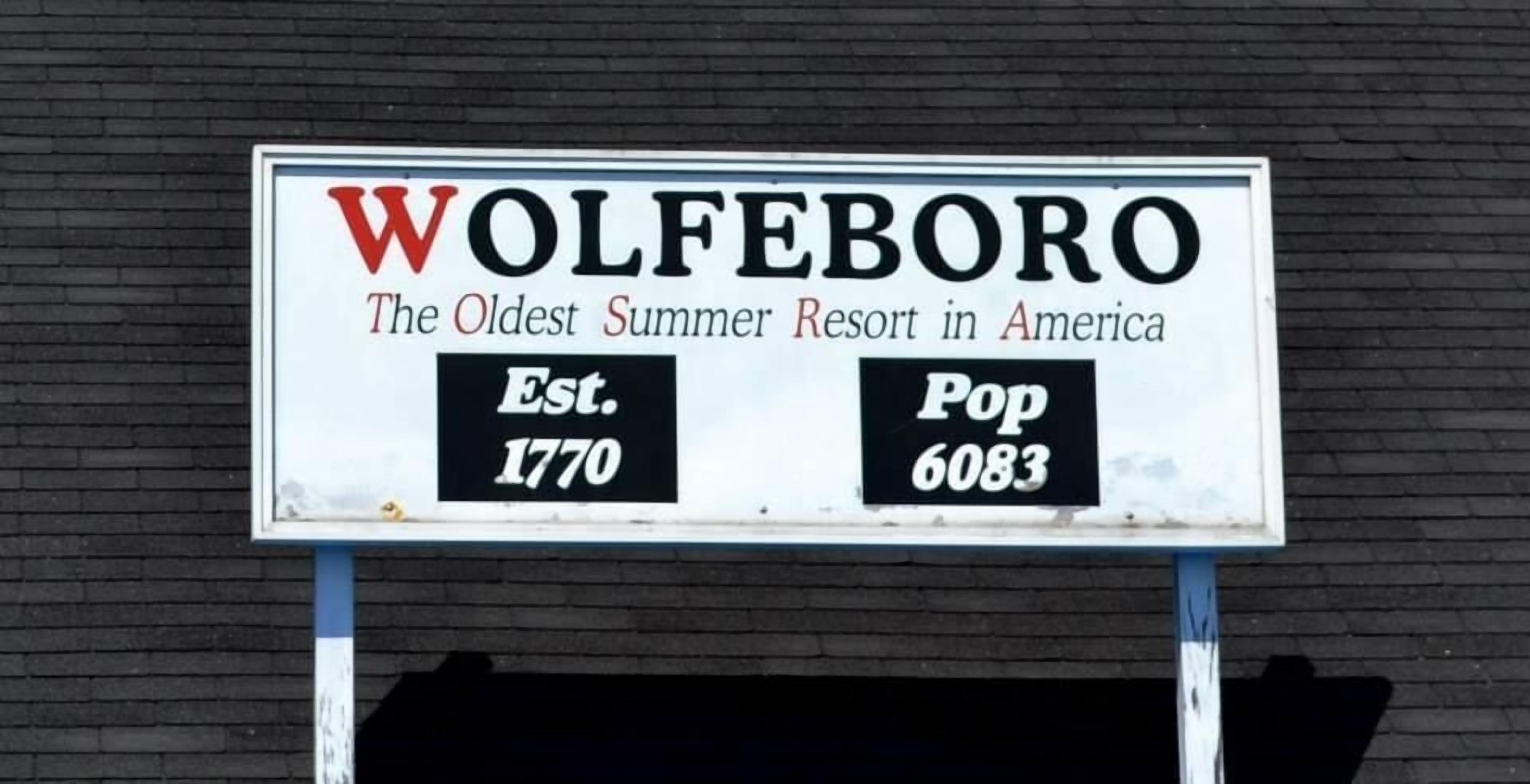 A sign for Wolfeboro, stating it is the oldest summer resort in America, established in 1770, with a population of 6083.