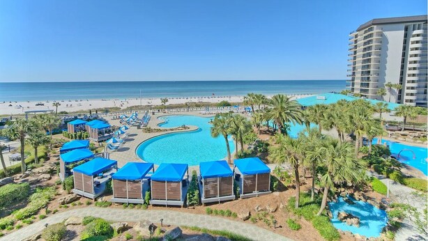 A resort with a large pool, beach, and a high-rise building. - Edgewater The Blue Pearl PCB Townhome Villa,1500 sq', Beach, Pools, Conference (Panama City Beach)