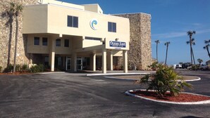 A building with a sign reading "Ocean East Resort Club."