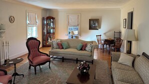 A living room with a sofa, armchairs, a coffee table, and a cabinet. - Beekeeper's House (Buena Vista)