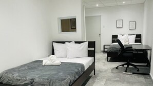 A modern bedroom with a bed, a desk, and a chair. - 5 Start* *New Lovely apartment in San Juan P.R. (San Juan)