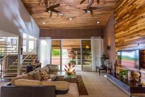 Large open floor plan with vaulted teak ceiling.