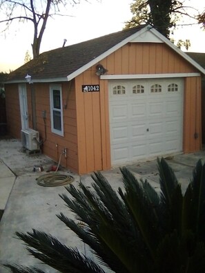 Home at 1042 features a single-story design with a sloped roof and small porch.