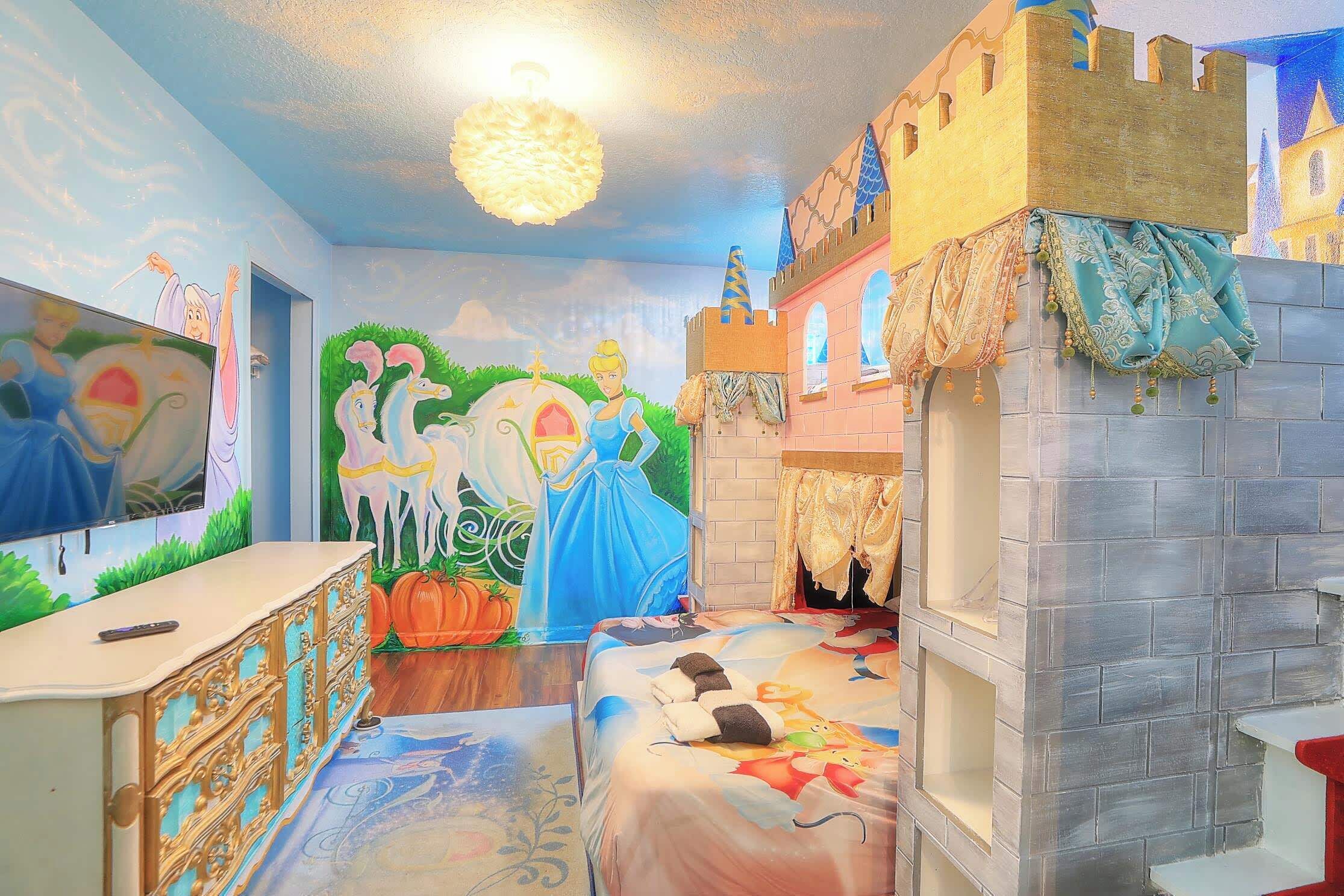 Upper Level: Bedroom 3:This is an enchanting Cinderella suite that boasts custom-built bunk beds with a dual staircase. This room features a twin bed over a queen bed, a Smart TV, a dresser, and a closet. Attached to an en-suite Jack & Jill full bath