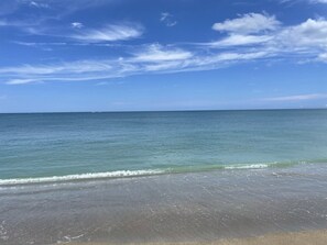 A beach with clear skies and calm waters.