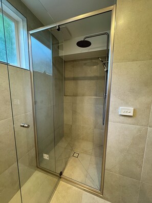 Shower, towels, soap, toilet paper