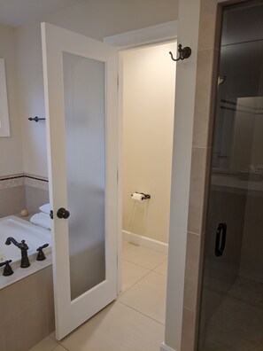 Combined shower/tub, hair dryer, towels, soap