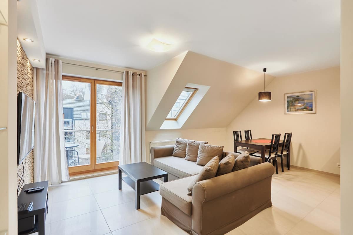 Standard Apartment | Living area | 42-inch TV with digital channels