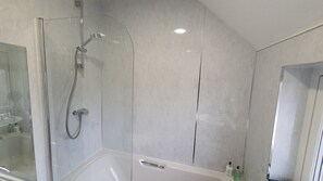 Combined shower/tub, hair dryer, towels, soap