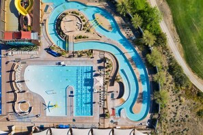 An aerial view of a swimming pool complex with multiple lanes, a central pool, and surrounding landscaping. - Privacy, Clean, Pickleball, Club House, Hiking, Mountains, Pet Friendly, Family Friendly (Scottsdale)
