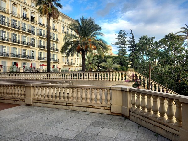 A historic building with ornate balconies and a stone balustrade.