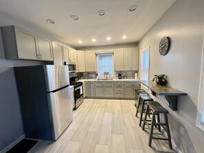 Microwave, coffee/tea maker, cookware/dishes/utensils