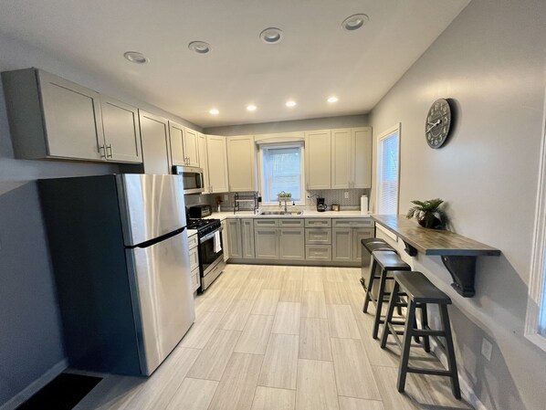 Microwave, coffee/tea maker, cookware/dishes/utensils