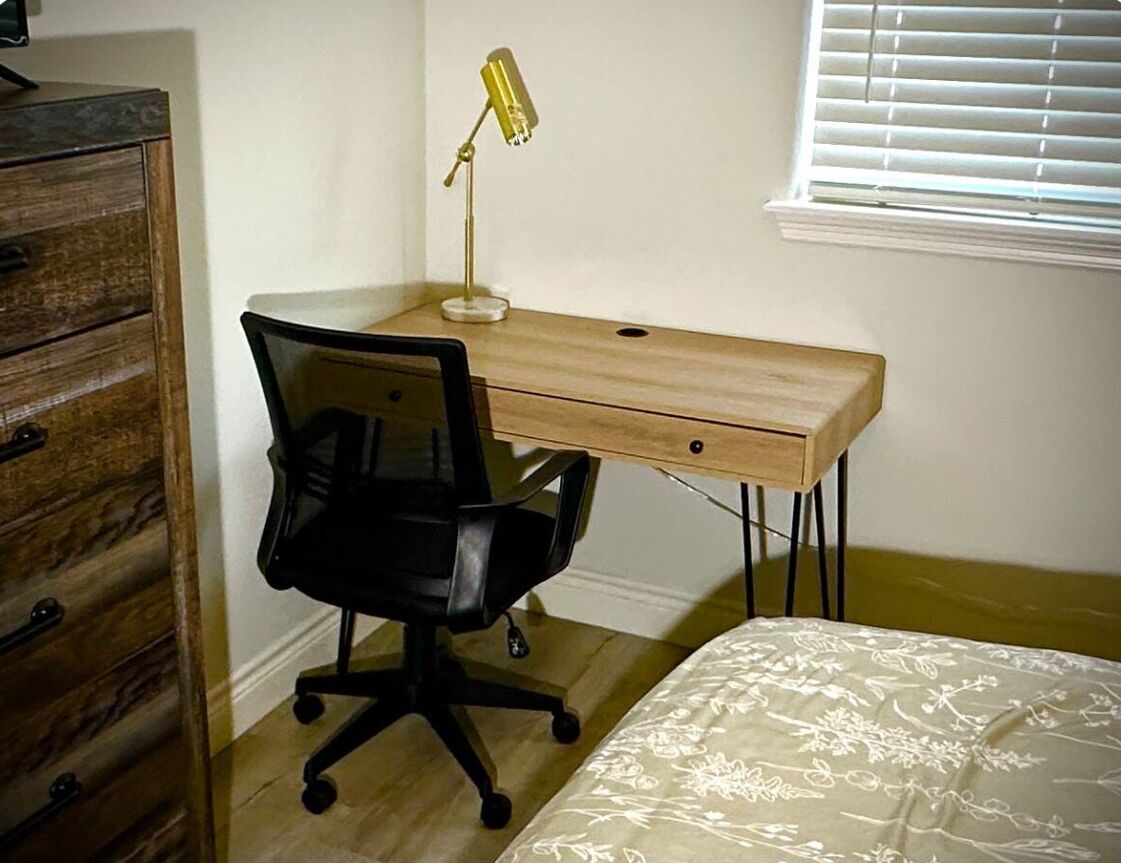 Upstairs bedroom #1, on the right with desk.