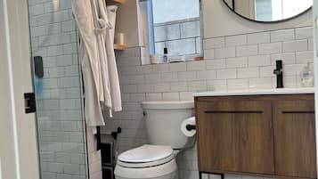 Shower, hair dryer, towels, toilet paper