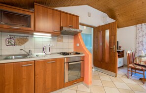 Fridge, stovetop, dishwasher, coffee/tea maker