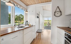 Fridge, stovetop, dishwasher, coffee/tea maker