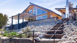 A modern house with a stone staircase leading to a wooden deck. - Gorgeous home in åmli with WiFi (Åmli)