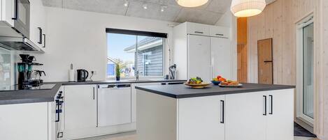 Fridge, stovetop, dishwasher, coffee/tea maker