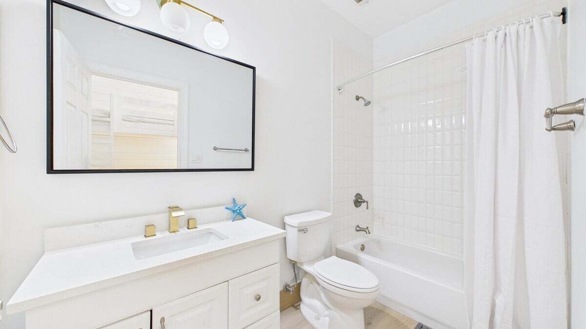 Full bathroom with shower and tub combo